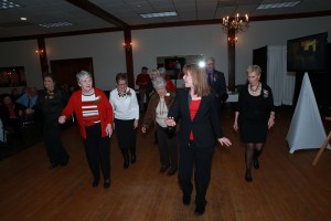 Anna from CKE teaching a group at the Billerica Senior Citizens Sweetheart Dance how to do the cupid shuffle!