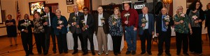 The winners of the centerpieces stand in a row, holding their centerpieces while their pic is taken, at the celebration of Brian Friberg - Senior of the year - Billerica, MA 01821 - 5-1-15