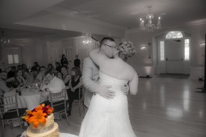 Bride and groom dance in back and white - but the cake is in full color.  