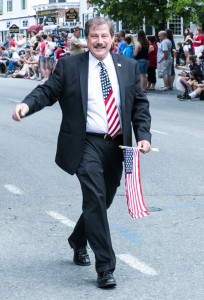Selectman Mike Rosa donates his life and his time for the good of Billerica. Here he is marching in the Memorial Day Parade with his USA flag and his USA neck tie.